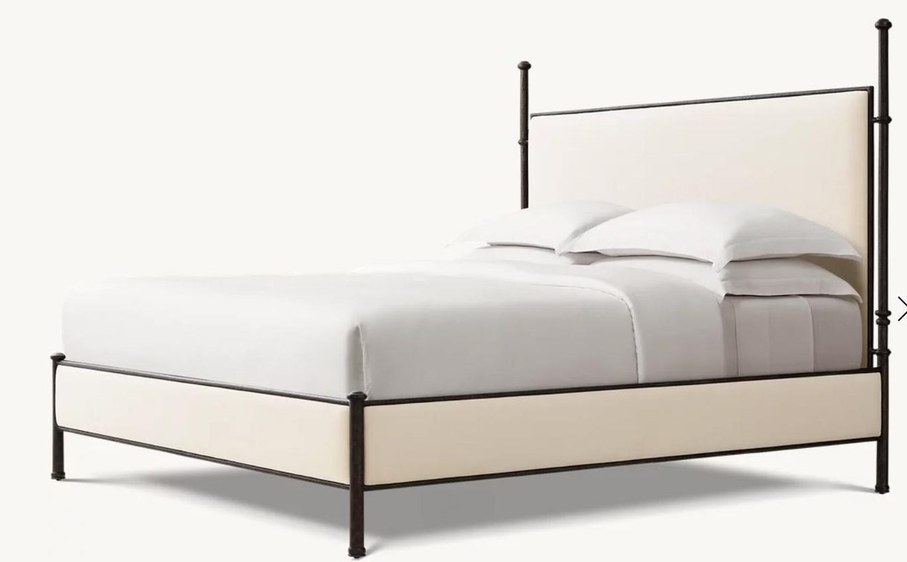 Grey upholstered bed with timber trim