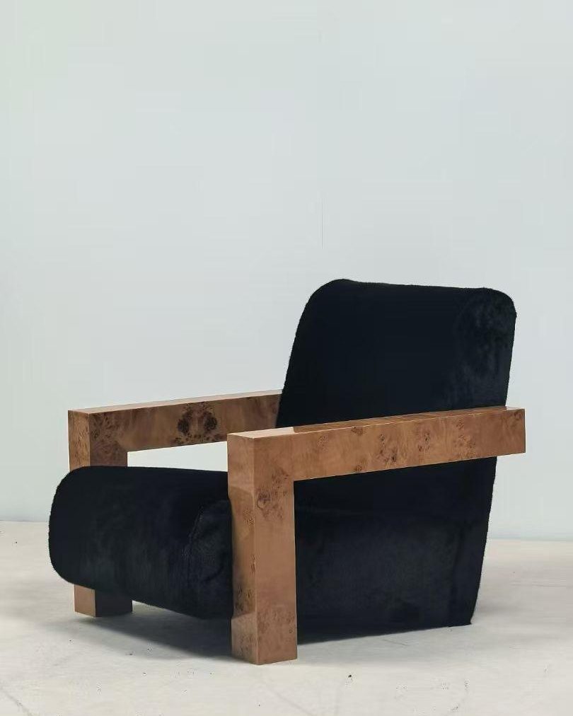 Black-framed lounge armchair with navy upholstery