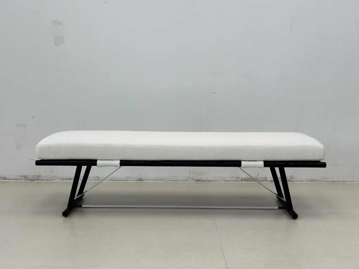 White bench with dark metal legs