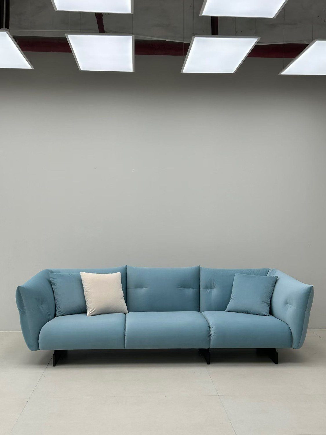 Blue upholstered three-seat sofa
